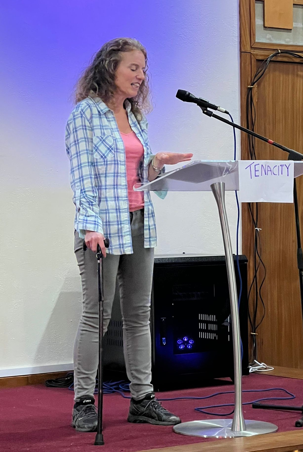 Gina speaking on stage